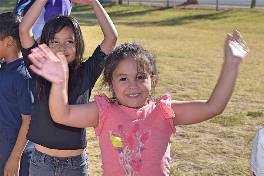 Girl with hands up